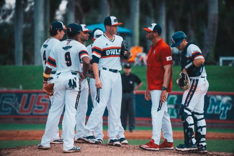UP stock photo of the infielders gather for a mound visit in the middle of an FAU baseball game. Photo by Alex Liscio.