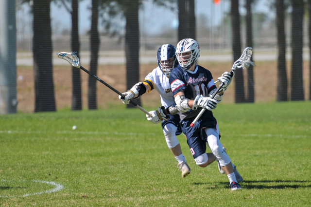 Mikey Clinton (pictured #10) gets past his defender while holding possession. Photo courtesy of the FAU Mens Lacrosse club.
