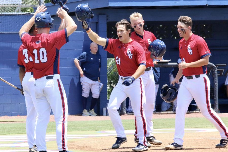 Mitchell Hartigan celebrates with teammates after hitting a grand slam against FIU in Game 1 on May 1, 2021. Photo courtesy of Noah Goldberg.