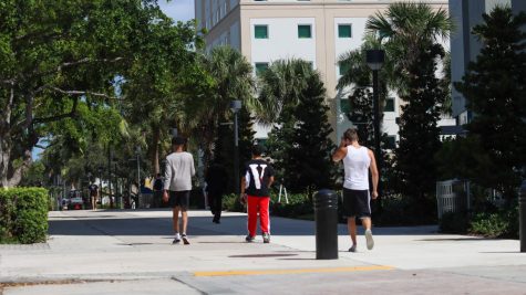 Students walk past Atlantic Park Towers. Photo by Eston Parker III.