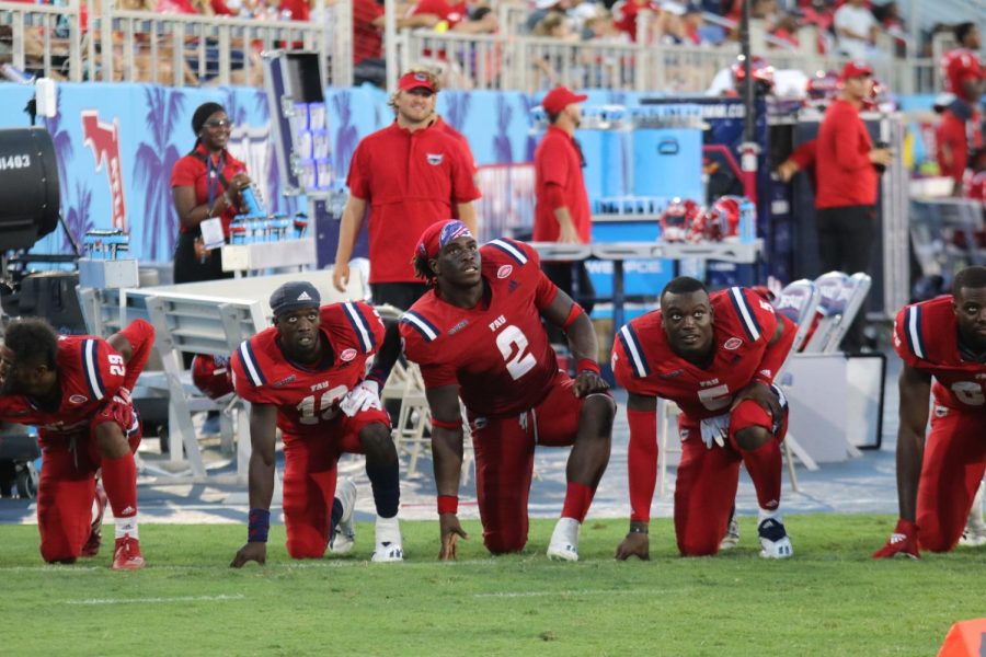 Willie Wright (left), Akileis Leroy (center), and Ahman Ross (right) wait for the final whistle against FIU on October 2, 2021. The Owls won their fifth straight over FIU. 