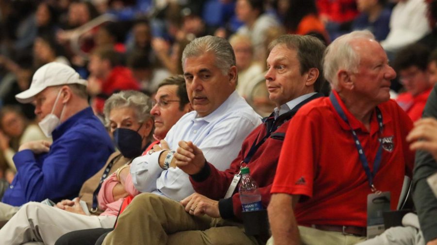 Chief of FAUs Board of Trustees, Anthony Barber (left), and FAU President John Kelly sit together during FAUs victory over Western Kentucky on January 20, 2022.