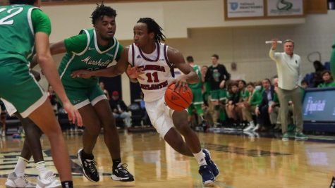 Michael Forrest pushing into the lane against Marshall on January 22, 2022. Forrest ended the game with 12 points in FAUs victory.