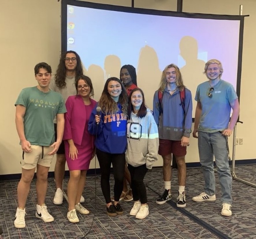 Deanna Mancuso (pictured front, second to left) formed Owls Speech and Debate in October 2021 to have students participate in public speaking.