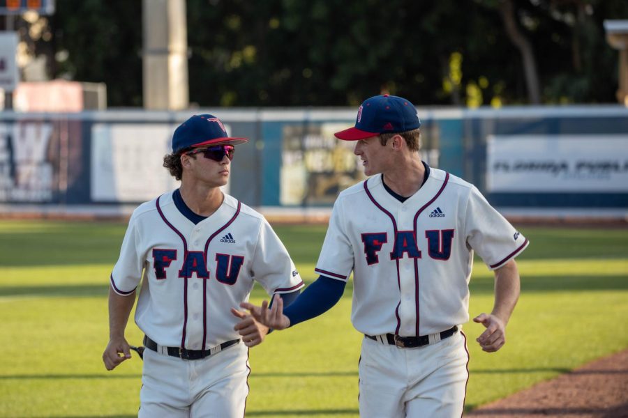 Daniel Tomasello and Jack Clarke running during pregame against UCF on April 5, 2022.