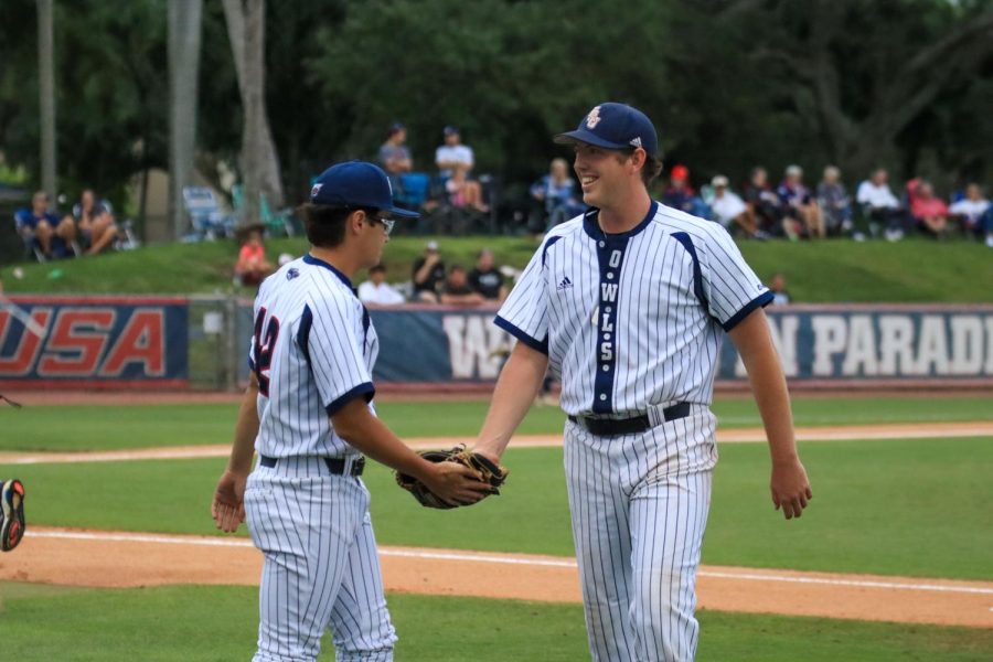 Sam Drumheller (left) and Hunter Cooley (right) heading to the dugout during the game against FIU on April 29, 2022.