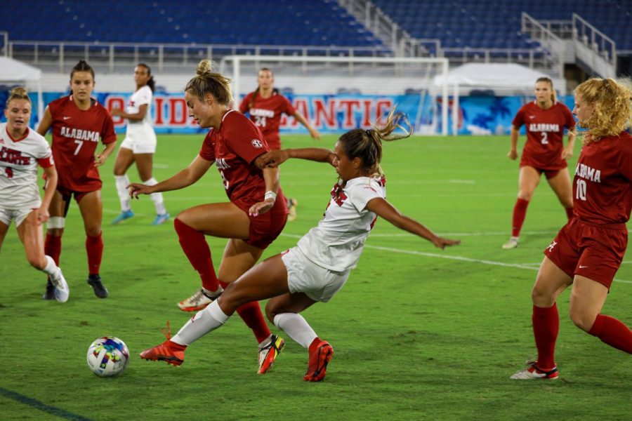 Defender Jodi Smith playing hard against Alabama Thursday August 18, 2022. Due to serious weather, the rest of the game was delayed to Friday afternoon.