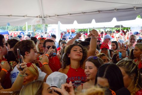 Students party under a tent before FAUs football game against FIU on Oct. 2, 2021.