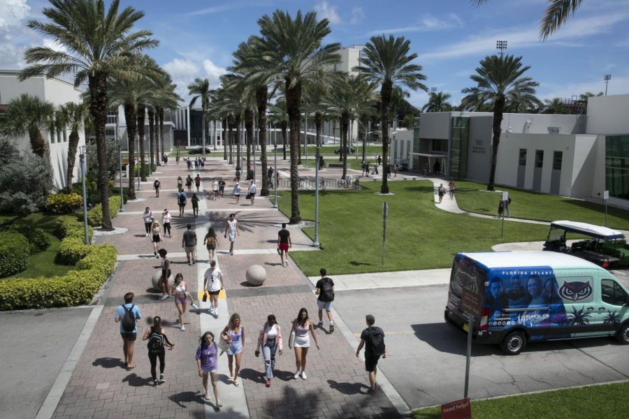 Students walking outside the Campus Recreation Center or entering Diversity Way.