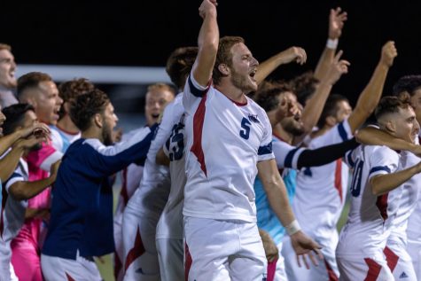 FAU mens soccer celebrate their victory over SMU, ranked 12th in the country, as they head to the stands to jumping to Sweet Caroline Friday night.