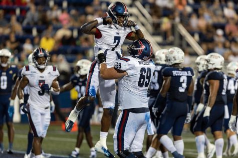 Brendan Bordner picks up Nkosi Perry after his touchdown against FIU on Nov. 12, 2022.