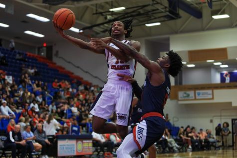 Senior guard Michael Forrest going for a heavily contested layup against South Alabama on Nov. 30, 2022. 