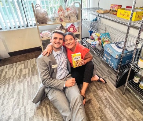 Student Body President Pierce Kennamer and Student Body Vice President Dahlia Calvillo pose in a food pantry.