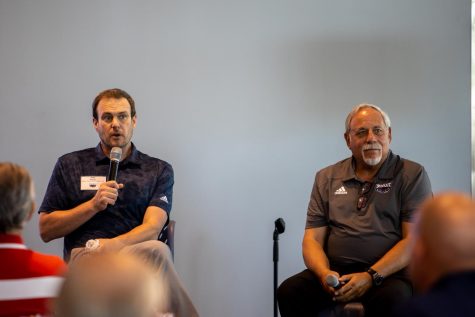 Head coach Tom Herman, pictured on the left, speaking at FAUs National Signing Day celebration on Feb. 1, 2023.