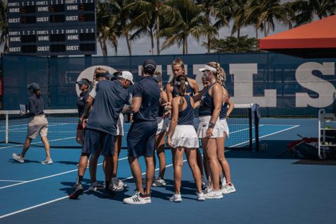 FAU womens tennis team gathered together after taking the lead in doubles against Maryland on Friday, March 24, 2023.