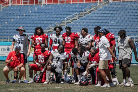 Owls celebrate their teamwork together after a Red victory in the Red vs White spring game on April 15th, 2023.