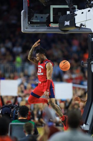Sophomore guard Alijah Martin throws down a dunk against San Diego State in the Final Four on April 1, 2023.