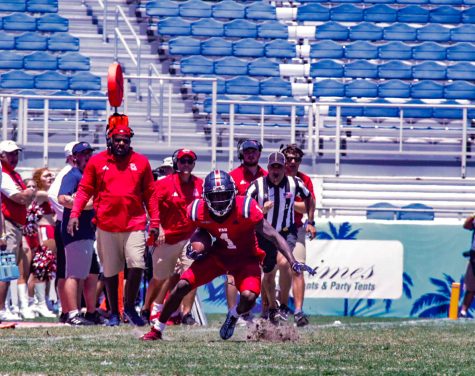 After recovering a pass from his quarterback, LaJohntay Wester (#1) runs down the field during the 2023 Spring Game.