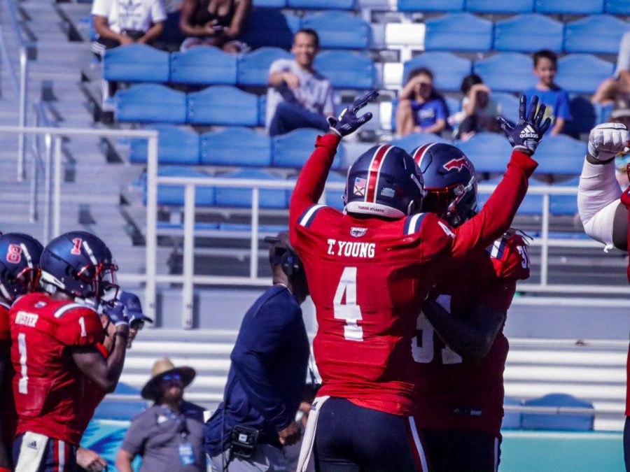 Former Owl safety Teja Young (#4) celebrates a pass deflection with fellow safety Dwight Toombs II (#31) during the Owls season finale loss to Western Kentucky last year.