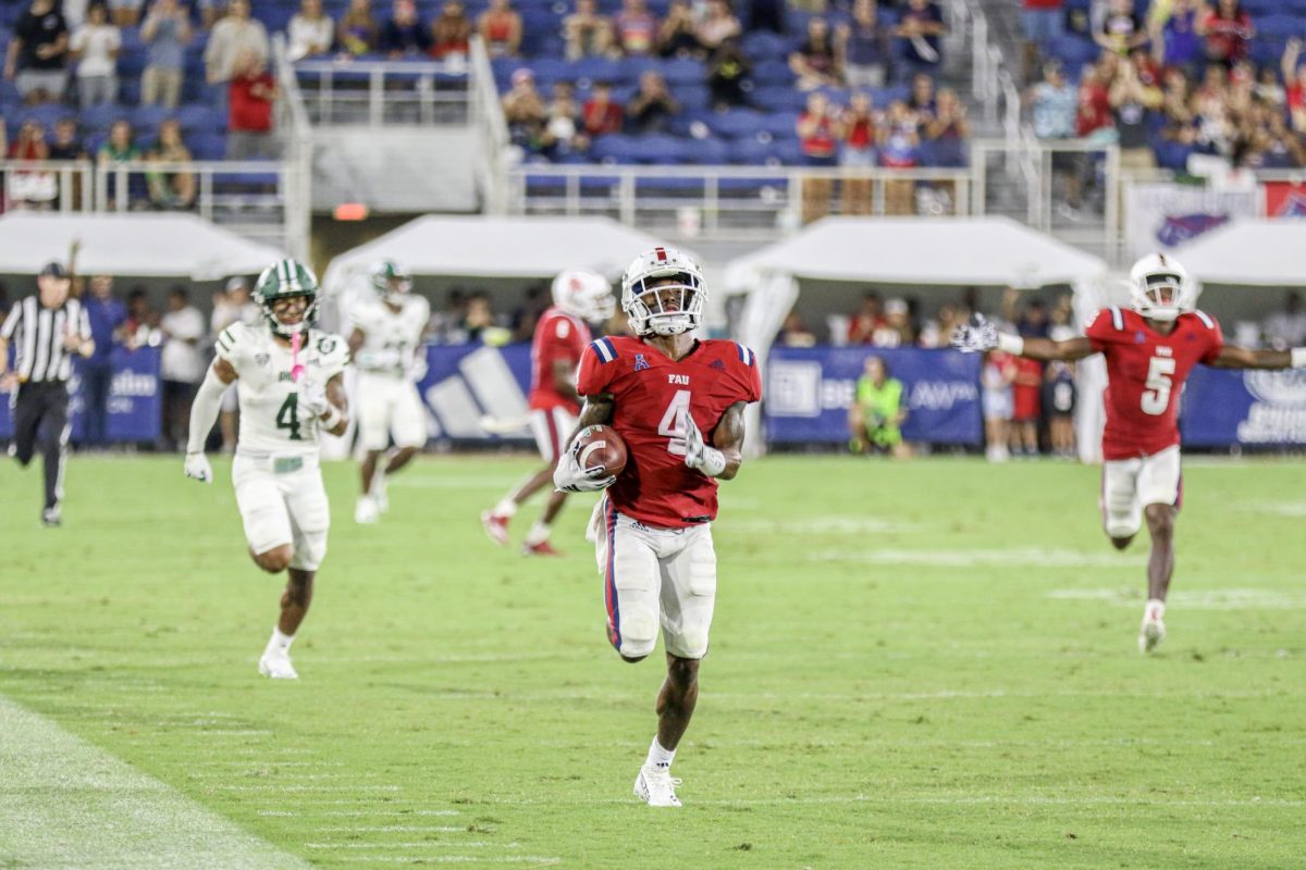 FAU+graduate+defensive+back+Jarron+Morris+%28%234%29+returning+an+interception+for+a+touchdown+during+the+Owls+17-10+loss+to+the+Ohio+University+Bobcats.+September+9%2C+2023.
