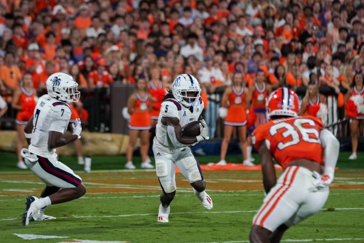 FAU graduate transfer running back Kobe Lewis (#5) advancing down the field during the Owls 48-14 loss to the Clemson University Tigers. September 16, 2023.