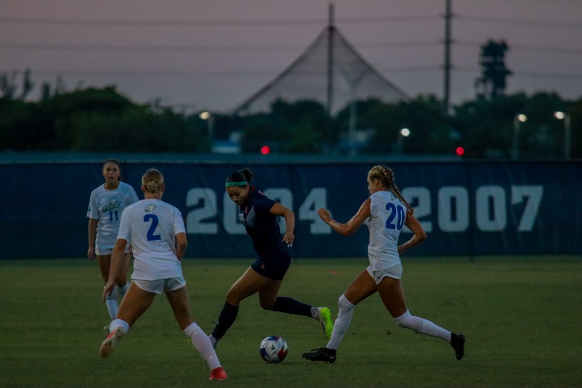 An FAU player playing against FGCU at home earlier in the season.