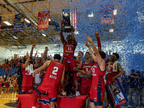 The FAU mens basketball team celebrating winning the Conference USA Regular Season Championship after they took down UTSA in February 2023.