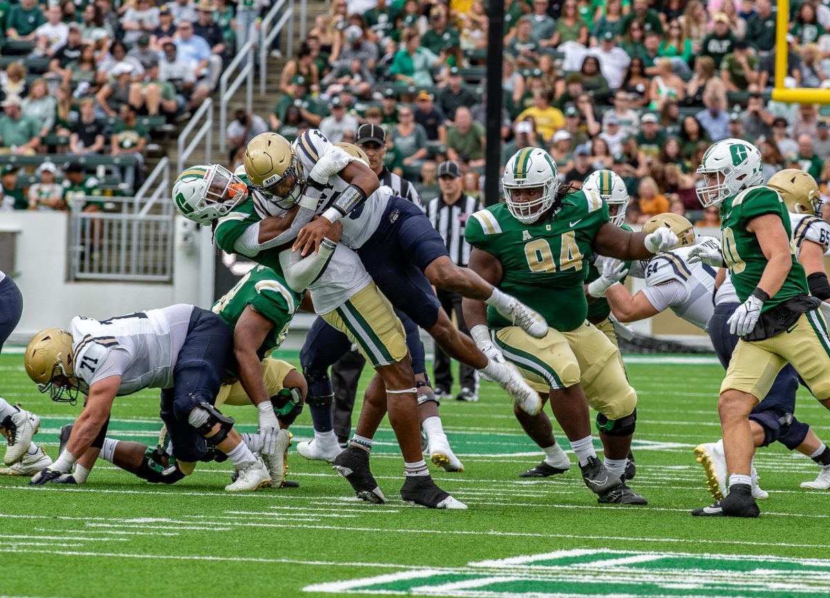 Charlotte defensive end Stone Handy sacking Navy quarterback Braxton Woodson in the 49ers 14-0 homecoming loss to Navy on Saturday, Oct. 14, 2023.
