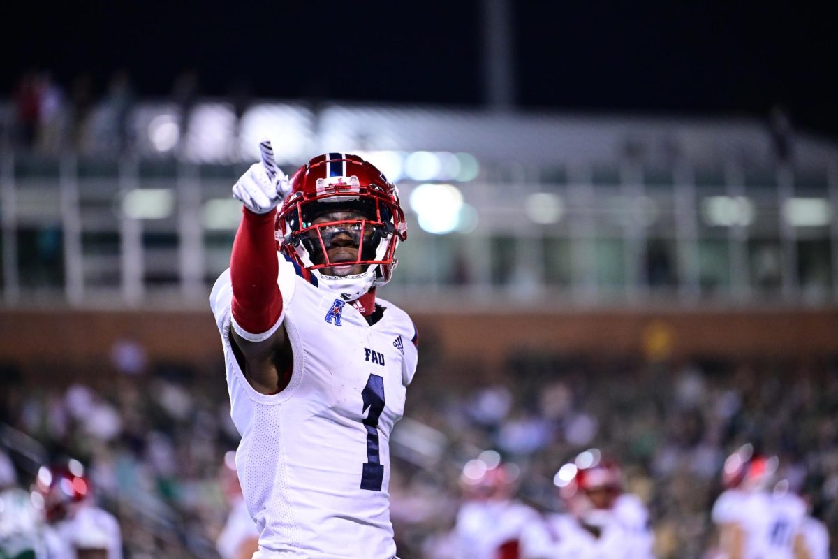 FAU junior wide receiver LaJohntay Wester (#1) pointing to family in the crowd after scoring his first touchdown of two on a career-high 149-receiving yard night against the Charlotte 49ers. The Owls won 38-16 on the road against the 49ers on Friday, Oct. 27, 2023.