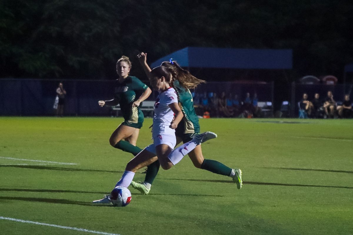 An FAU player progressing the ball against two defenders during FAUs 1-1 tie against the University of Alabama-Birmingham Blazers on Sept. 28, 2023.