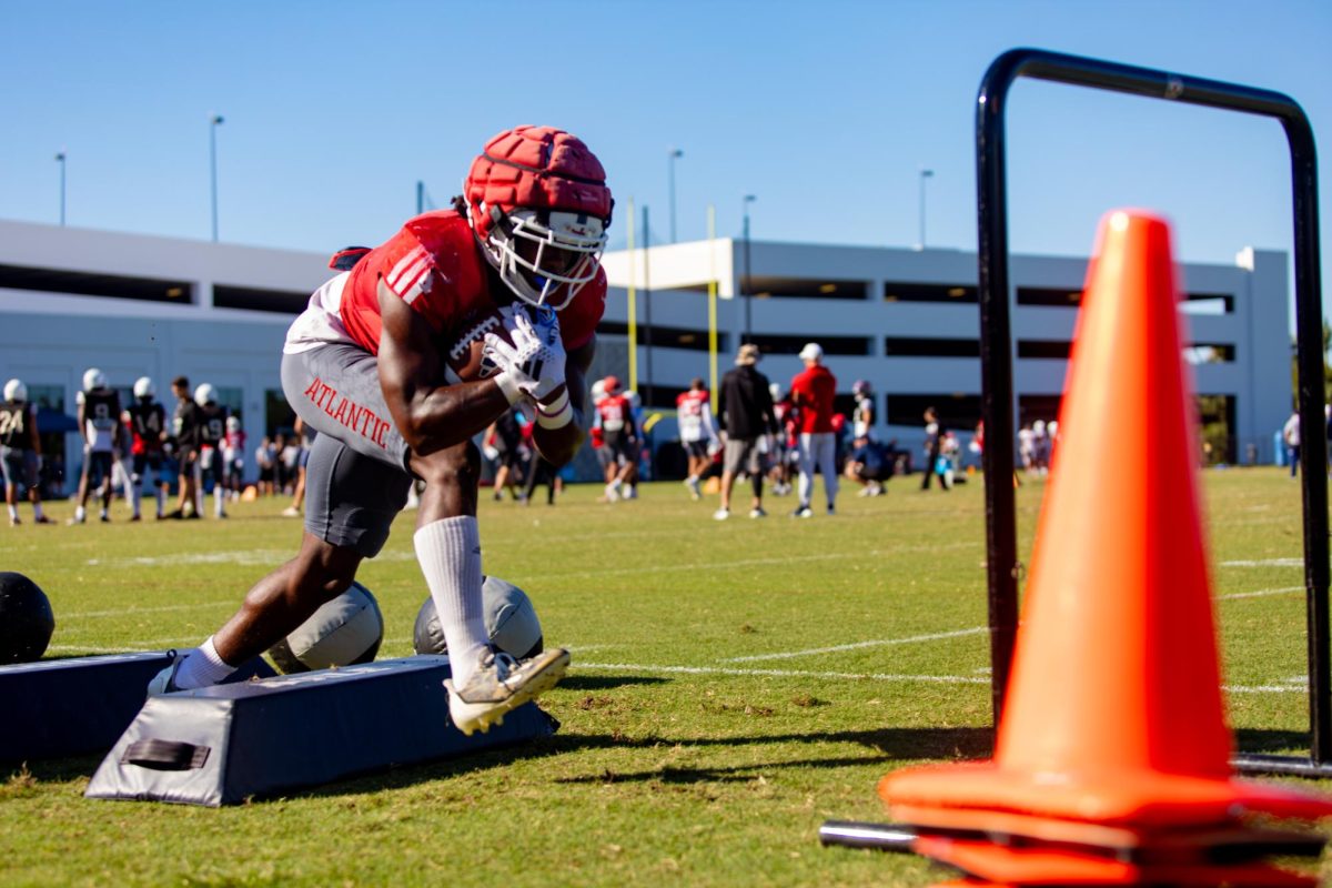 FAU graduate running back Kobe Lewis practicing his footwork and ball security during practice on Tuesday, Oct.17, 2023 at FAU’s practice facility