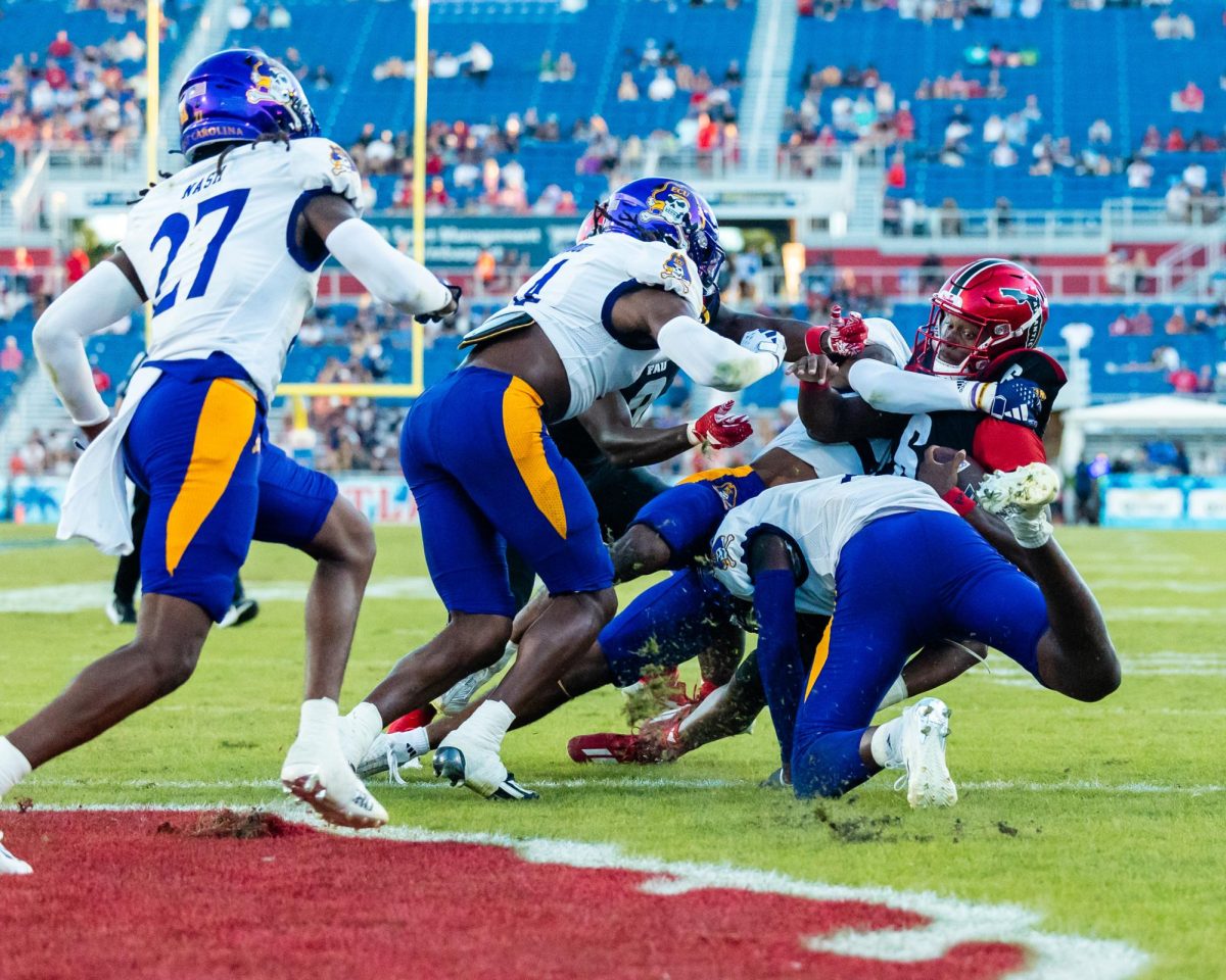 FAU redshirt junior quarterback Michael Johnson Jr. (#6) breaks the plain to score the Owls only touchdown of the game in the second quarter during their 22-7 loss to the East Carolina Pirates on Saturday, Nov. 11, 2023.
