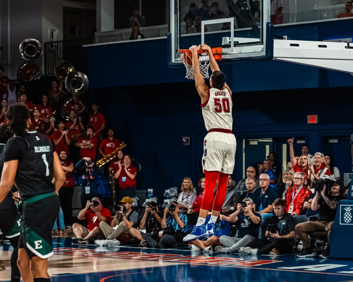 FAU junior center Vlad Goldin (#50) dunks the basketball in the opening seconds of the Owls 100-57 win against Eastern Michigan during the Owls first home game in over 250 days on Tuesday, Nov. 14, 2023.