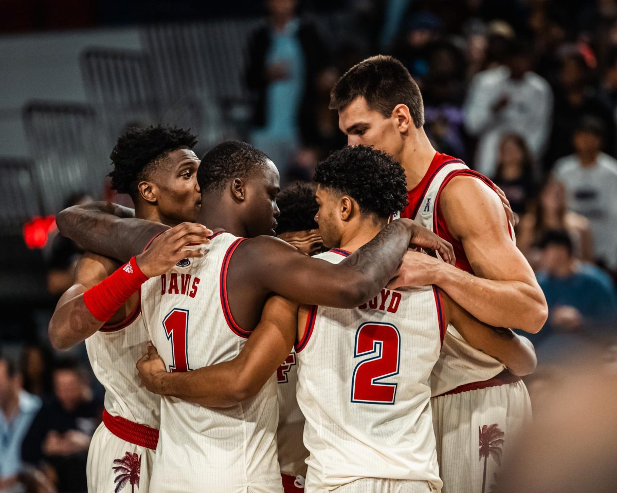 The+FAU+mens+basketball+team+in+huddle+prior+to+their+100-57+home+opener+victory+over+Eastern+Michigan+on+Tuesday%2C+Nov.+14%2C+2023.