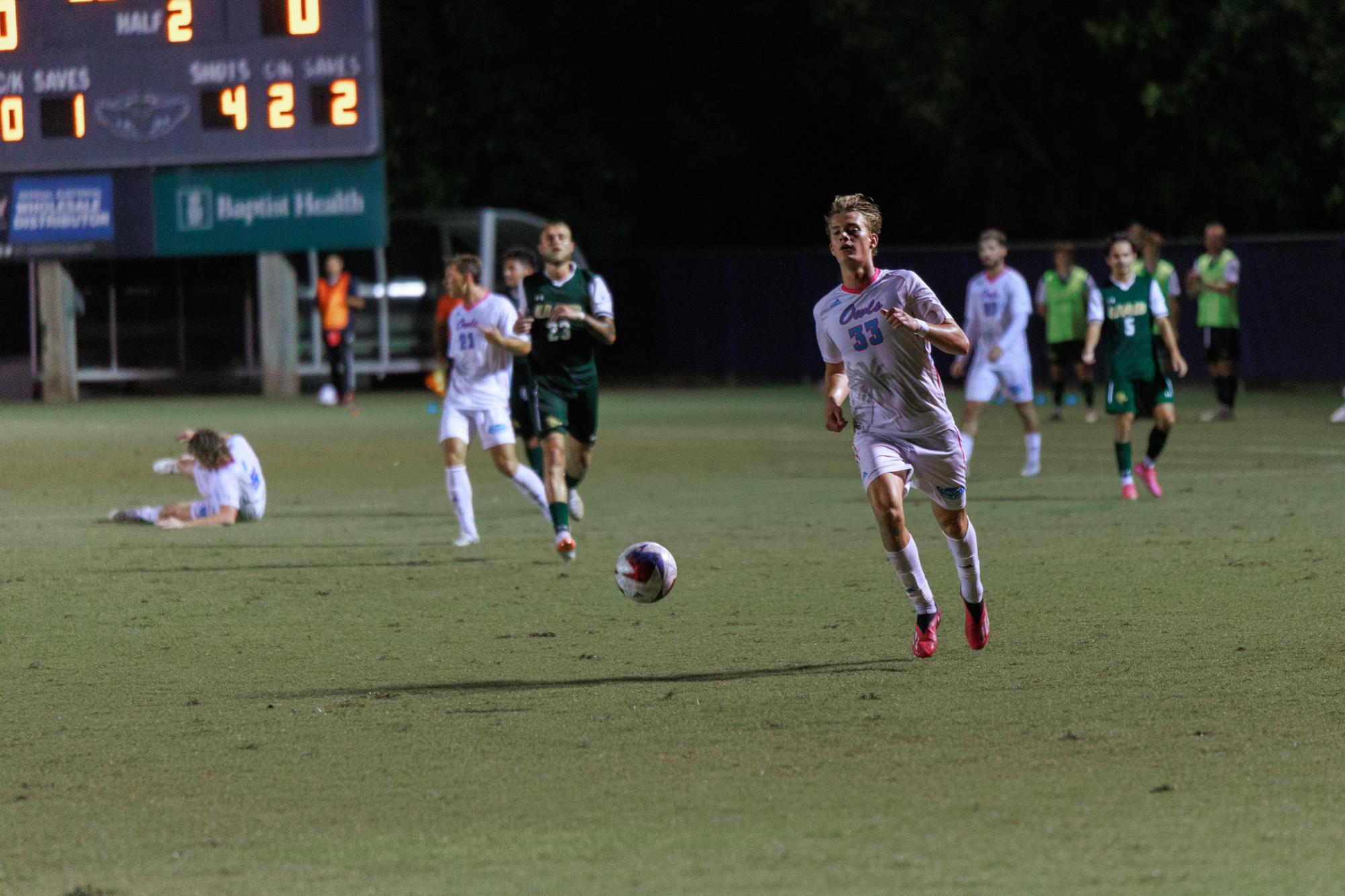 FAU junior forward Noah Kvifte (#33) retrieving the ball during the Owls 2-0 home win over the University of Alabama at Birmingham on Sunday, Oct. 8, 2023.