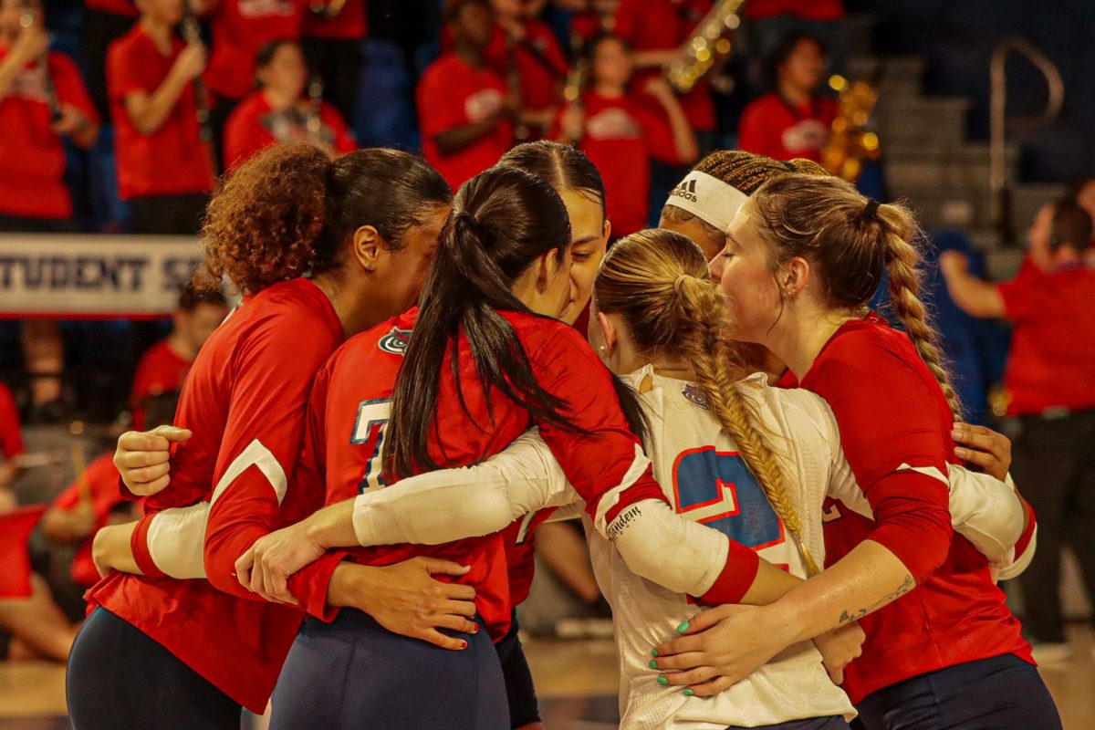 FAU players huddled up during the match against USF on Thursday, Nov. 16, 2023 at Eleanor R. Baldwin Arena.