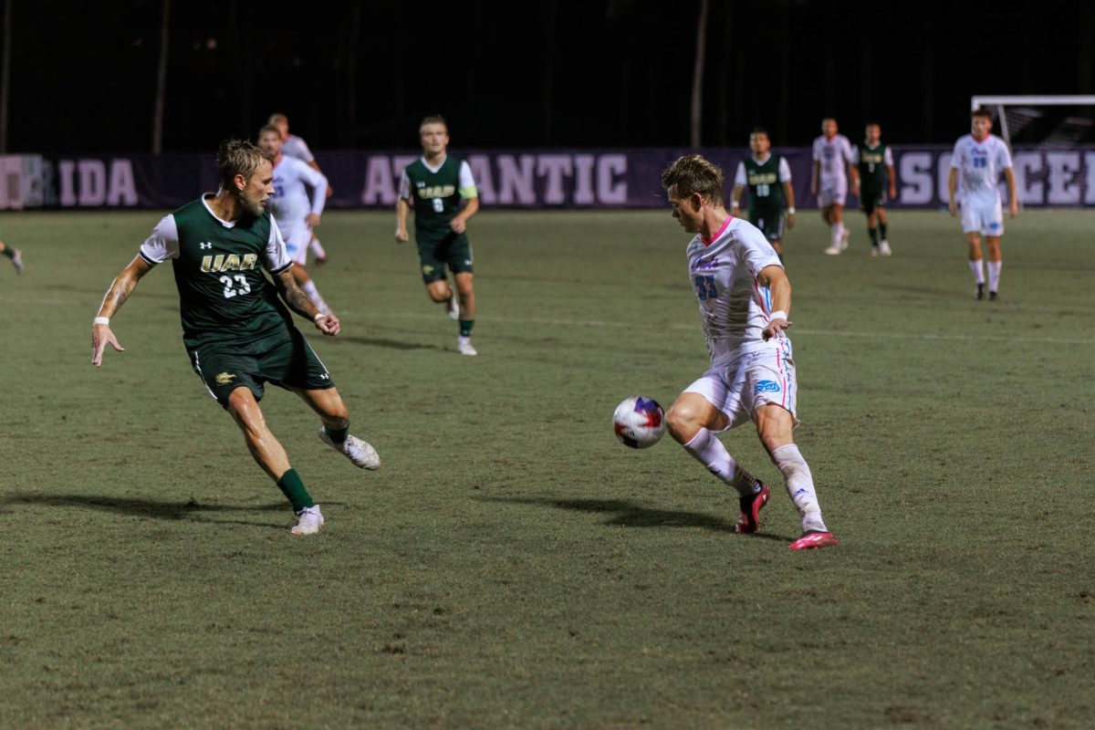 FAU junior forward Noah Kvifte (#33) progressing the ball down the field against the University of Alabama-Birmingham Blazers during the Owls 2-0 win over the Blazers on Sunday, Oct. 8, 2023.