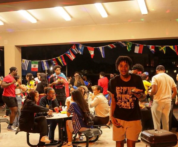 Students eating and socializing at “El Apagón” BBQ on Thursday night November 9.
