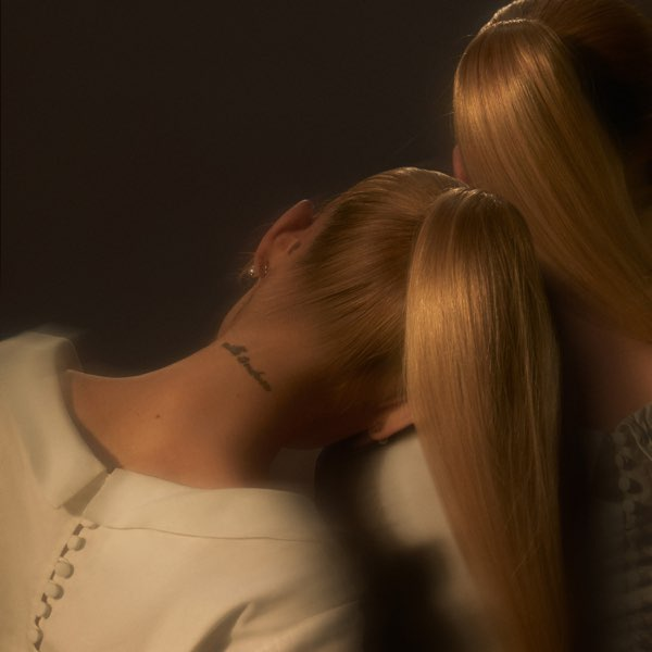 The album cover seemingly portrays Grande leaning on her shoulder, a reference to the album’s theme of self-growth.