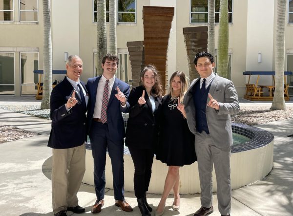 Frank de la Torre, Justis Sisk, Dara Jaffe, Jazzie Camacho and Alexander Esquen (left to right) celebrate their win by posing a “Number One” hand sign.
