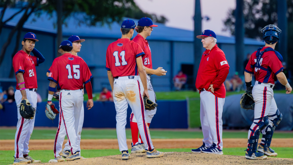 John McCormack on the mound with FAU baseball players in their 14-9 loss to Wichita State, Apr. 13.