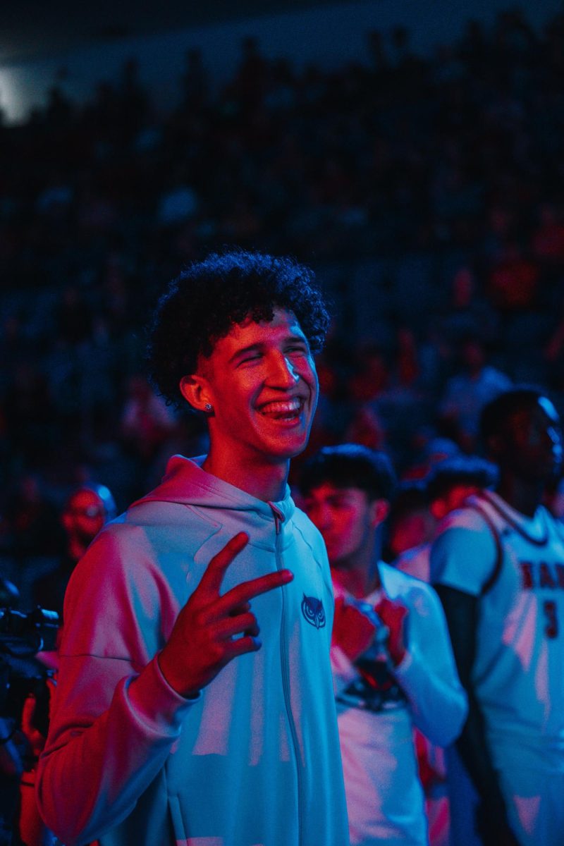 Freshman guard Zion Sampaio posing for the camera on the sidelines in FAU‘s game against St. Bonaventure on Sunday, Nov 30 at Eleanor R. Baldwin Arena.
