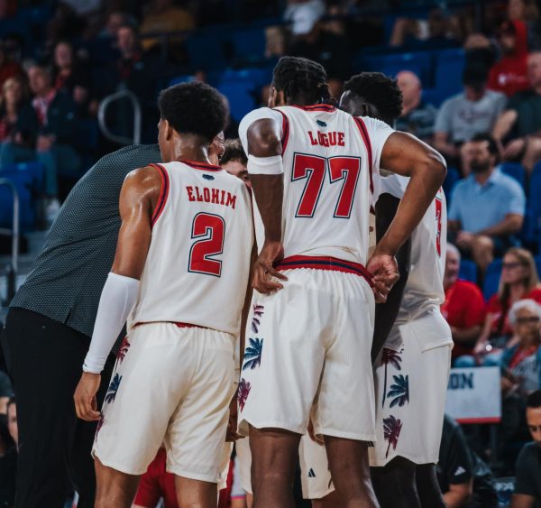Sophomore guard Isaiah Elohim (left) and sophomore forward Maxim Logue (right) huddle together during a timeout in FAU's game vs. St. Bonaventure on Sunday, Nov. 30 at Eleanor R. Baldwin Arena.
