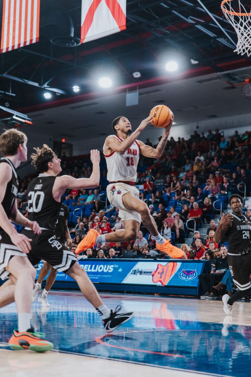 Junior guard Kanaan Carlyle jumping into. a layup in FAU‘s game against St. Bonaventure on Sunday, Nov 30 at Eleanor R. Baldwin Arena.