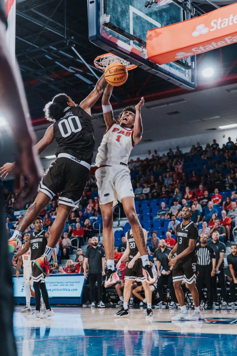 Sophomore forward Devin Williams dunking the ball over the defender in FAU‘s game against St. Bonaventure on Sunday, Nov 30 at Eleanor R. Baldwin Arena.