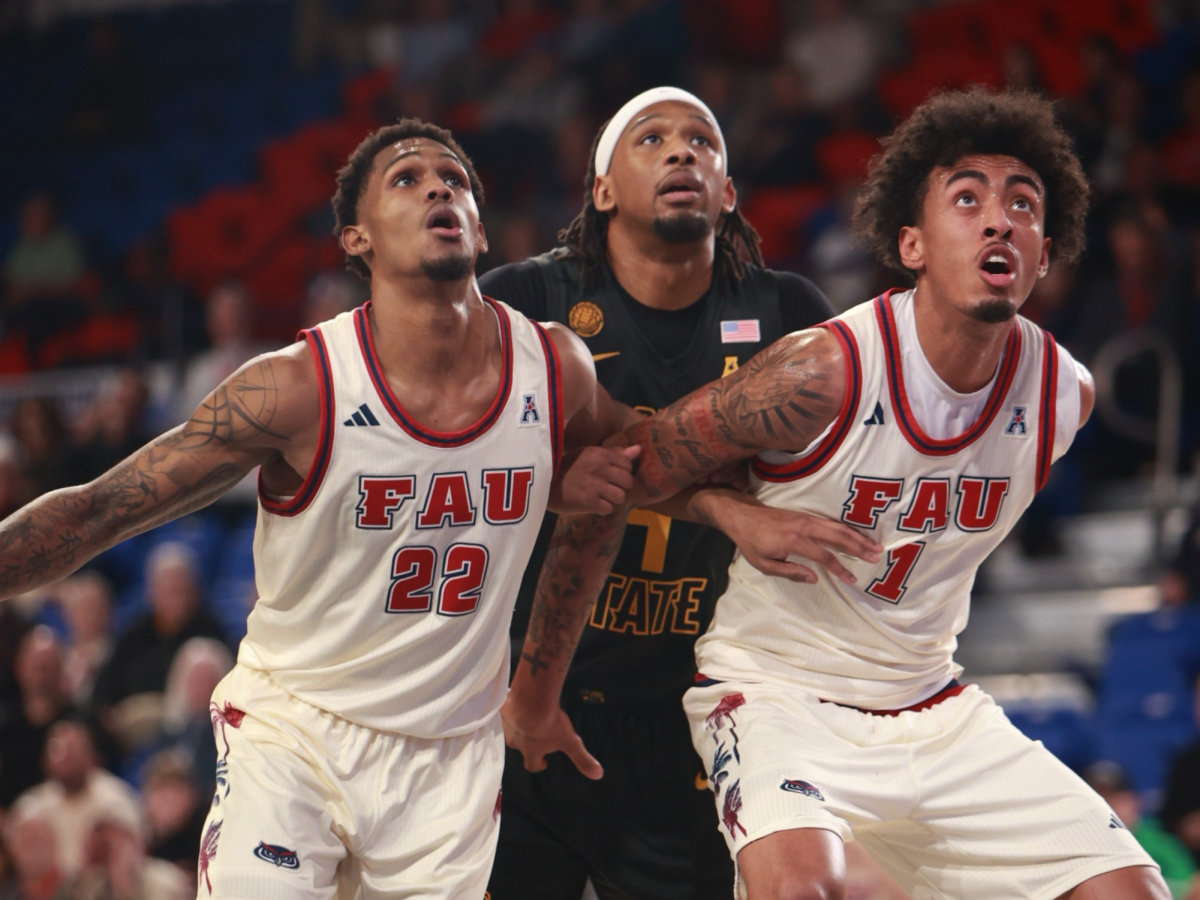 Guard Devin Vanterpool (left) and forward Devin Williams (right) boxing out a player on defense in FAU’s matchup against Wichita State on Thursday, Jan. 16 at the Eleanor R. Baldwin Arena.
