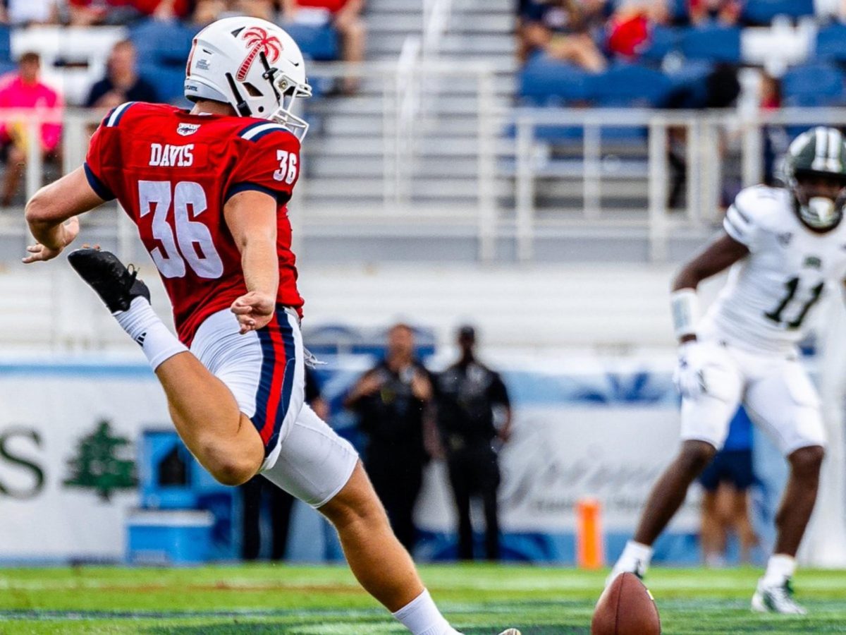 FAU Alum Carter Davis kicking the ball off at Flagler Credit Union Stadium.
