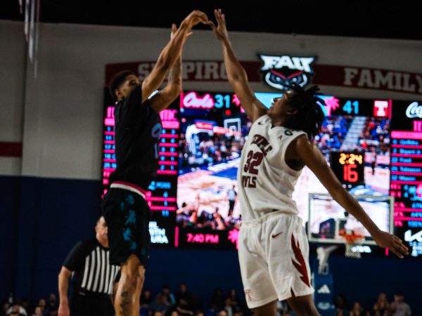 FAU guard Kanaan Carlyle shoots a three-pointer over defender Jordan Mason during FAU’s 77-73 win over the Temple Owls on Thursday, Feb. 26, 2026, at Eleanor R. Baldwin Arena.