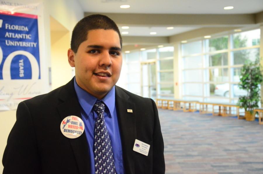 House Speaker and College Democrats President Boris Bastidas stands outside the Majestic Palm Room on September 24, greeting people as they arrive. Photo by Christine Capozziello.