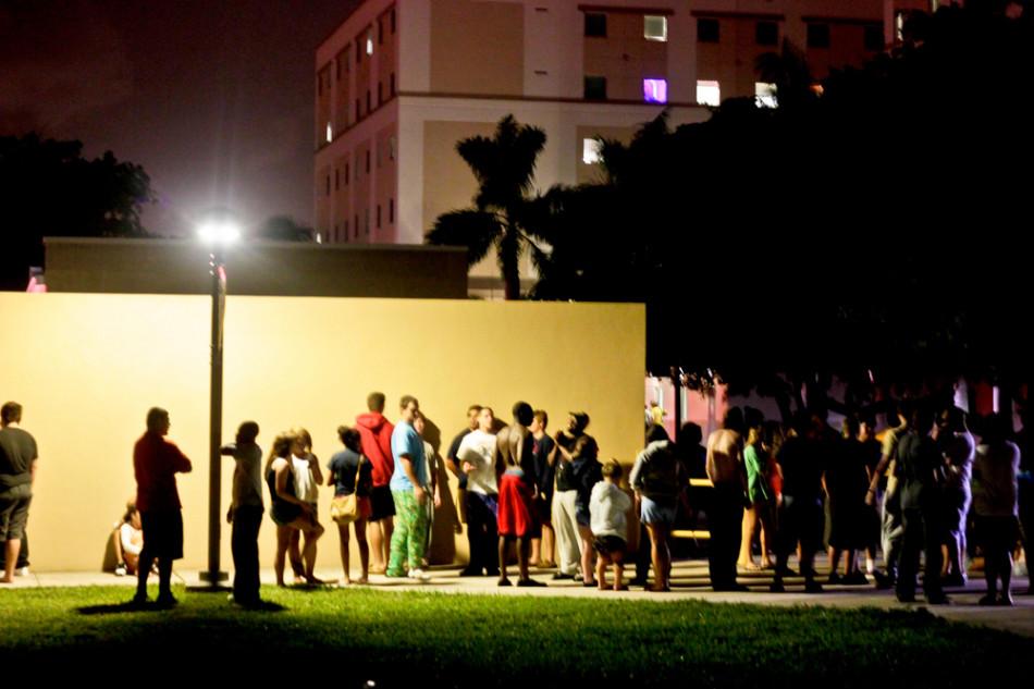 Students wait outside Glades Park Towers. Photo by Charles Pratt.
